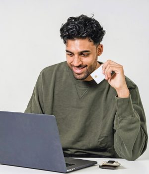 Man with credit card and laptop sora-shimazaki crop sm